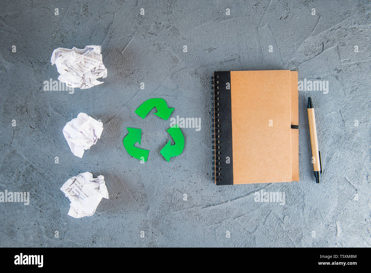 Concept of paper recycling used paper turned into recycle paper notebook. Cutout recycling