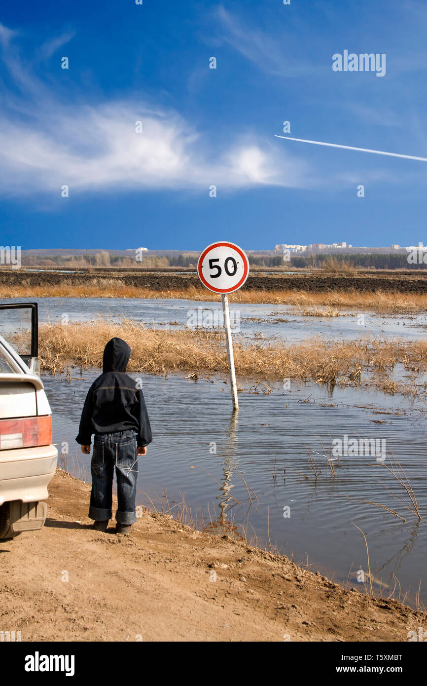 Unexpected situation on a flooded road Stock Photo