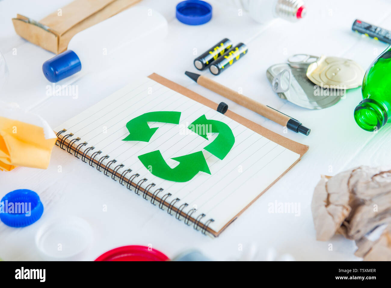 Recycle paper notebook with Green eco symbol surrounded with non