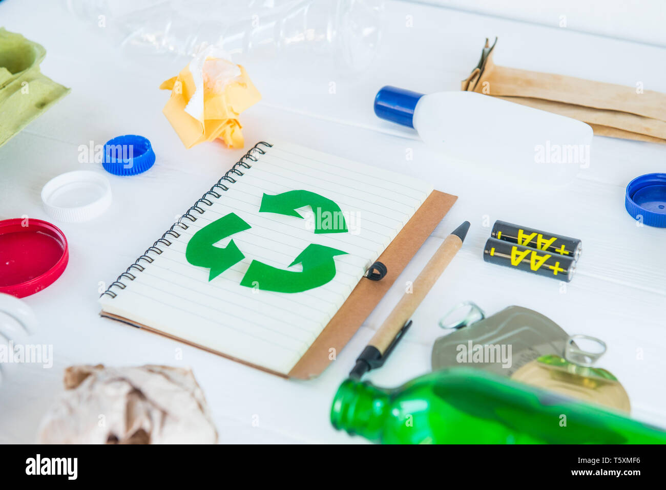 Recycle paper notebook with Green eco symbol surrounded with non