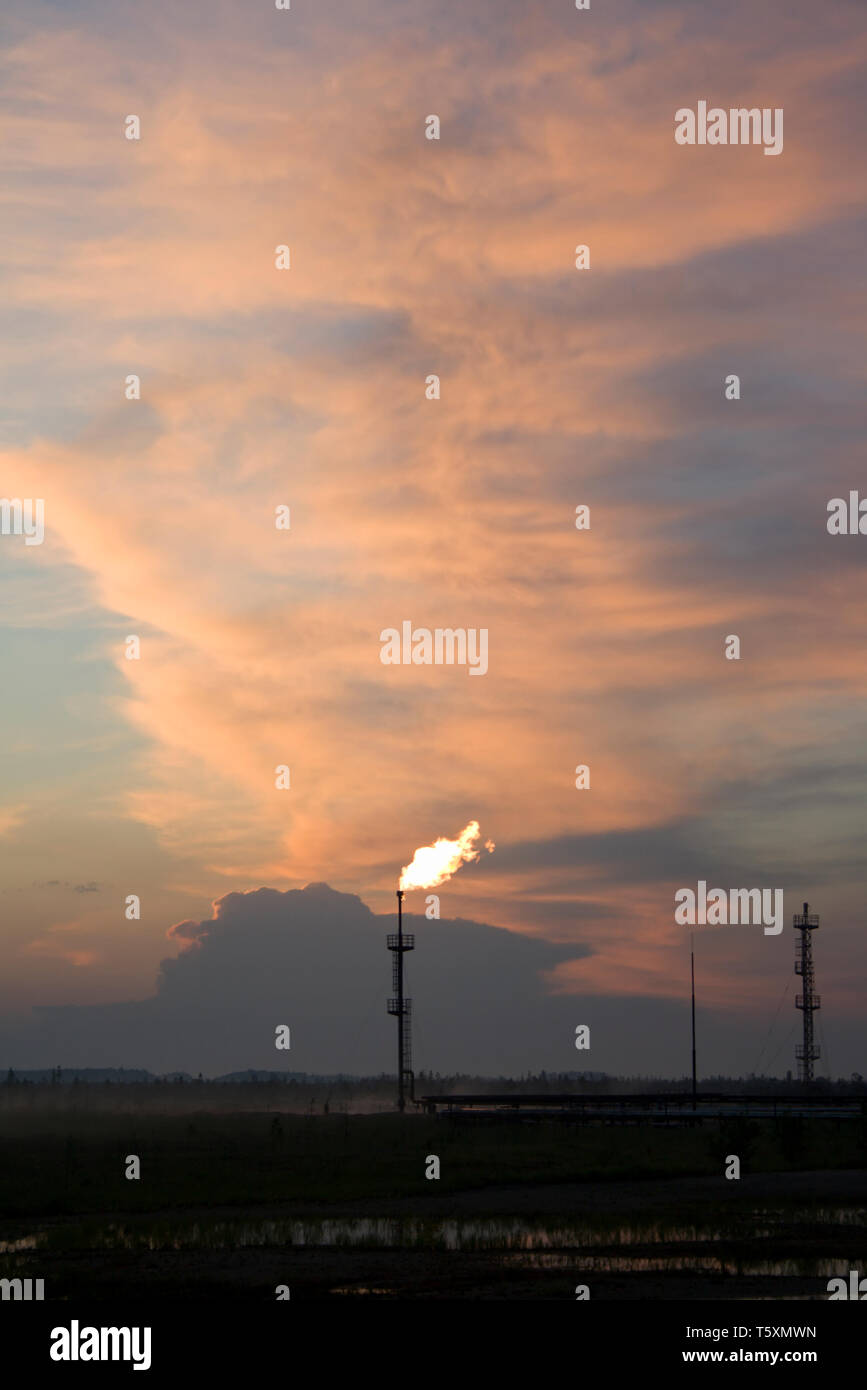 Colorful sunset on a oil refinery plant Stock Photo - Alamy