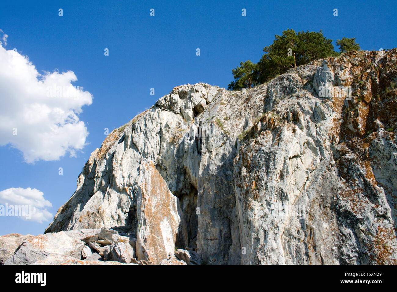 Above Rocks Blue sky and white clouds above rock Stock Photo - Alamy