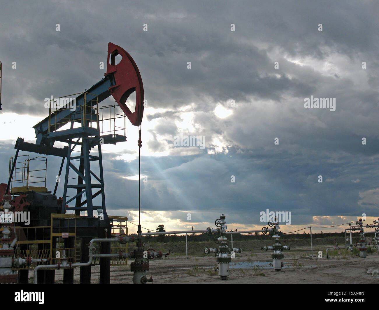 Pump on sunset. West Siberia. Stock Photo