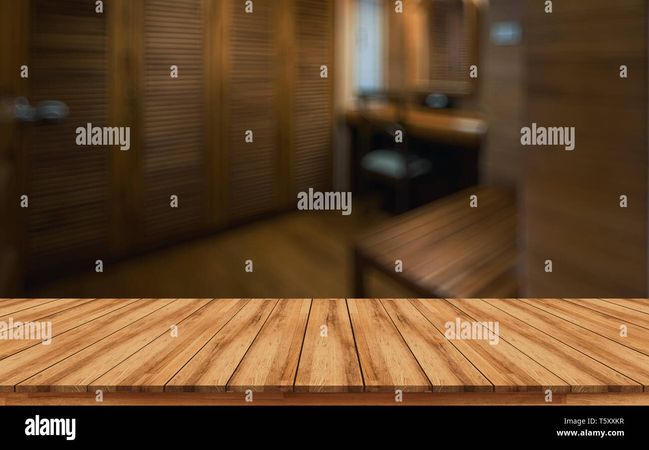 Empty wooden board with blurred spa room background design for health and fitness concept can use for montage products display or design key visual la Stock Photo