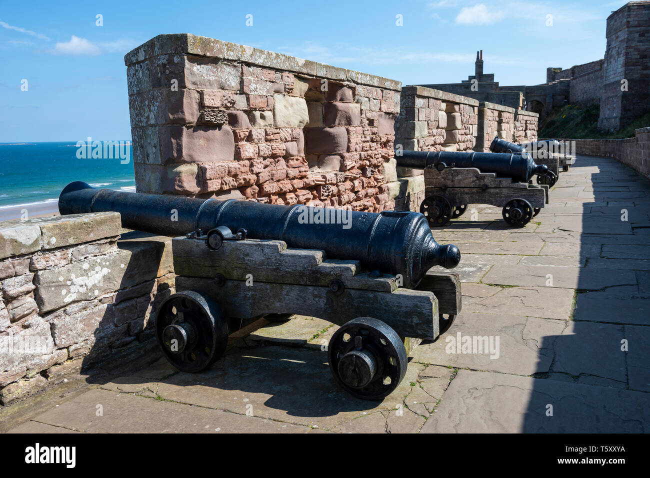 Canons on Battery Terrace at Bamburgh Castle, Northumberland, England, UK Stock Photo