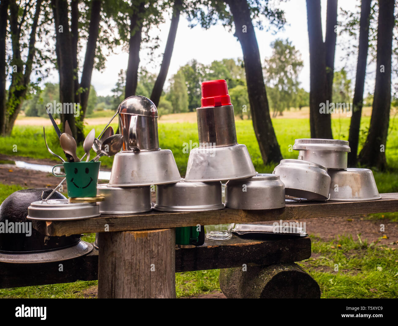 Washed the mess tin after cooking a meal on a campfire during a  canoeing excursion on the Wieprza river. Poland. Europe. Eastern Europe Stock Photo