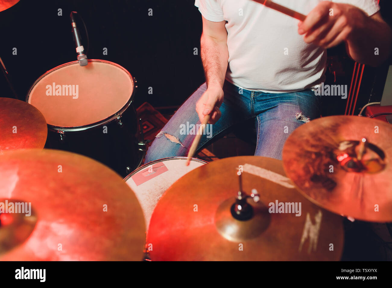 Musician plays drums in a rock band Stock Photo Alamy