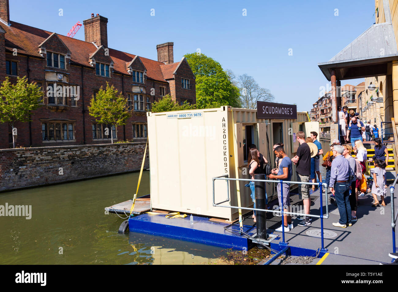 Tourists queue for tickets to punts at Scudamores quay on the River Cam, University town of Cambridge, Cambridgeshire, England Stock Photo