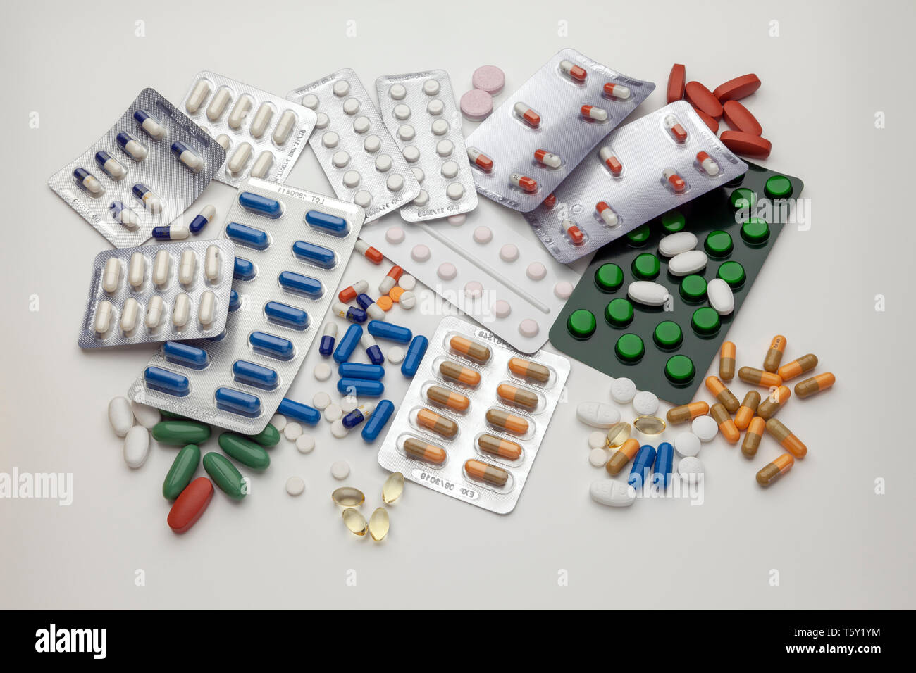 A selection of prescription drugs in blister packs and loose, capsules and tablets Stock Photo