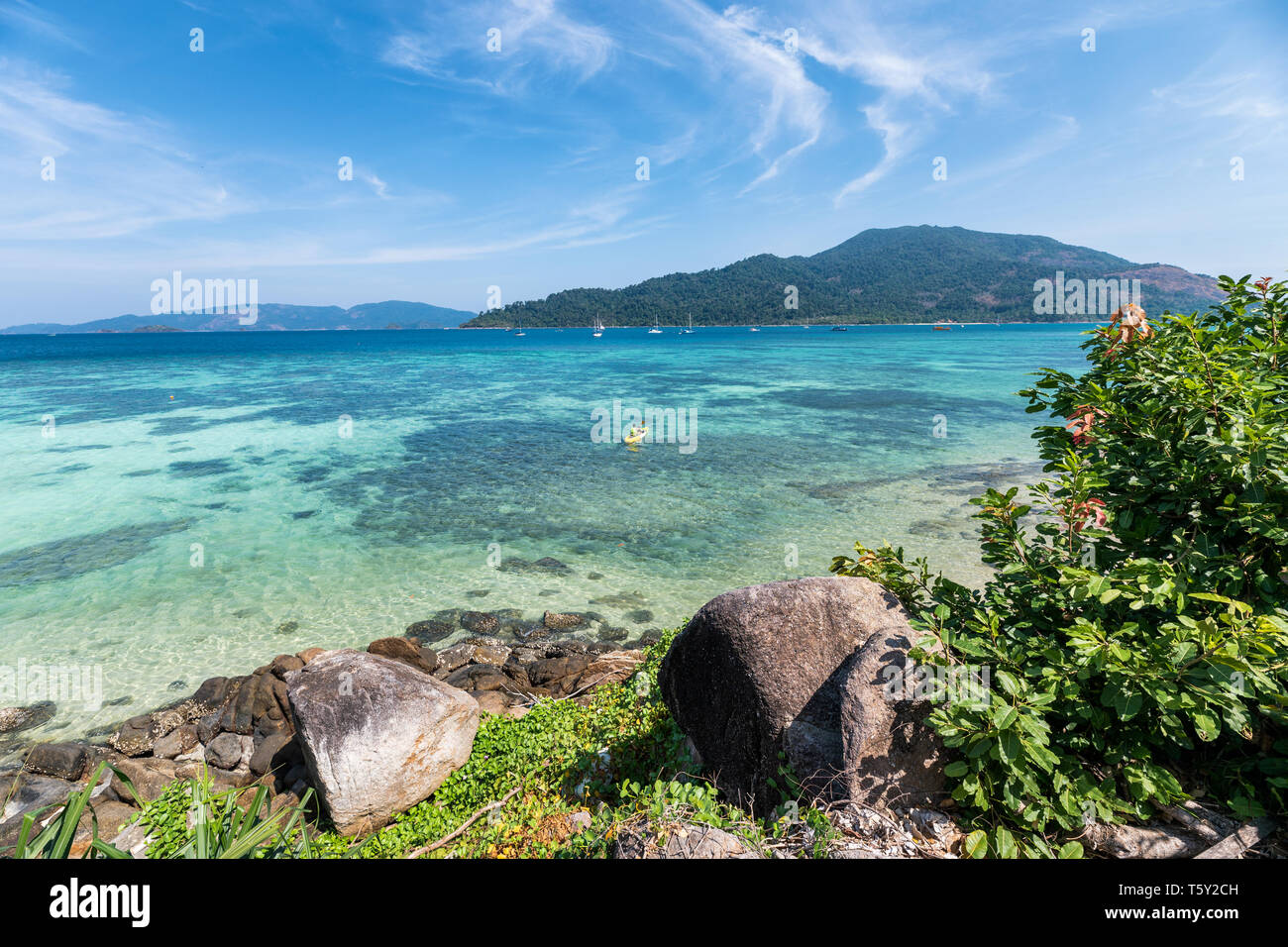 Beautiful tropical sea with coral reef and rocks on coastline at lipe ...