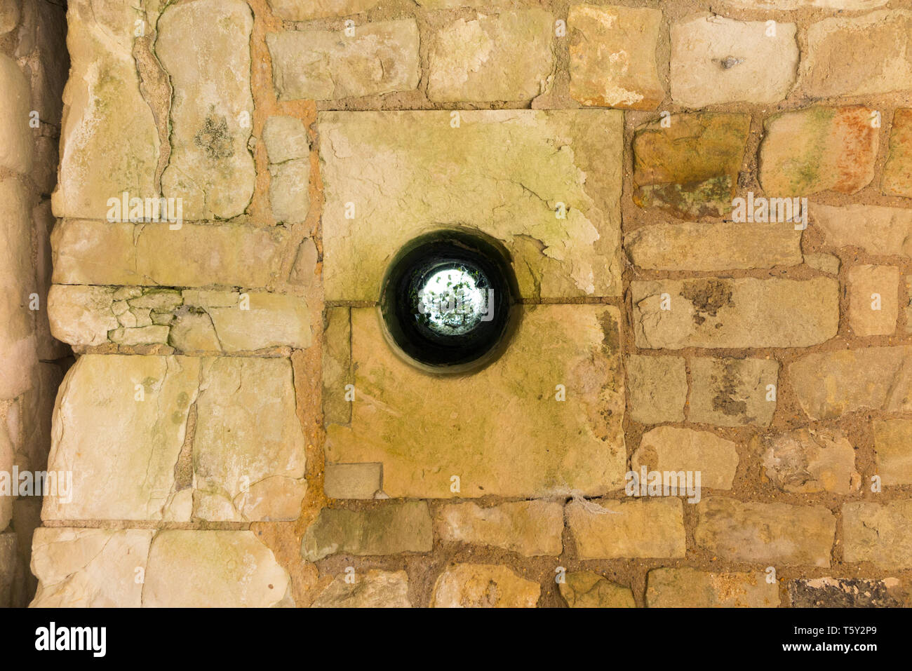 The murder hole (through which defenders would drop deadly objects) at  the entrance of Farnham castle in Surrey, UK. The murder hole is seen from below, looking up. (108) Stock Photo