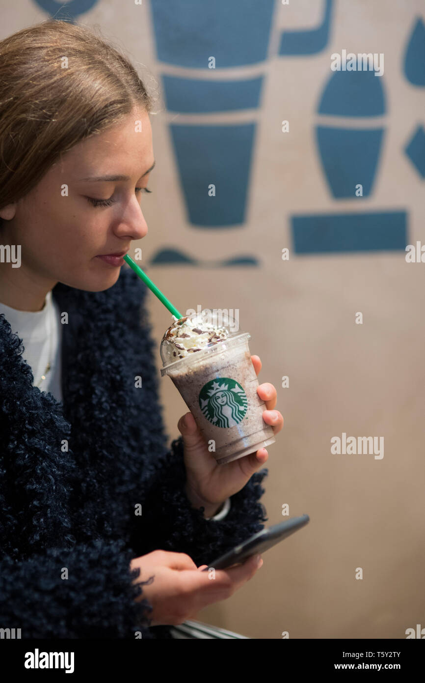 Teenager in a Starbucks in düsseldorf Stock Photo