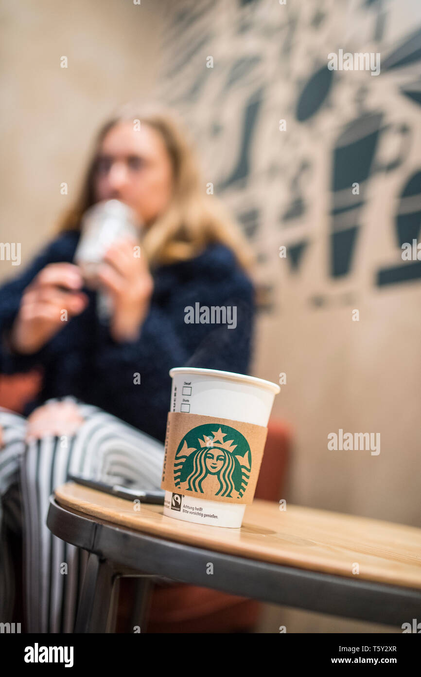 Teenager in a Starbucks in düsseldorf Stock Photo