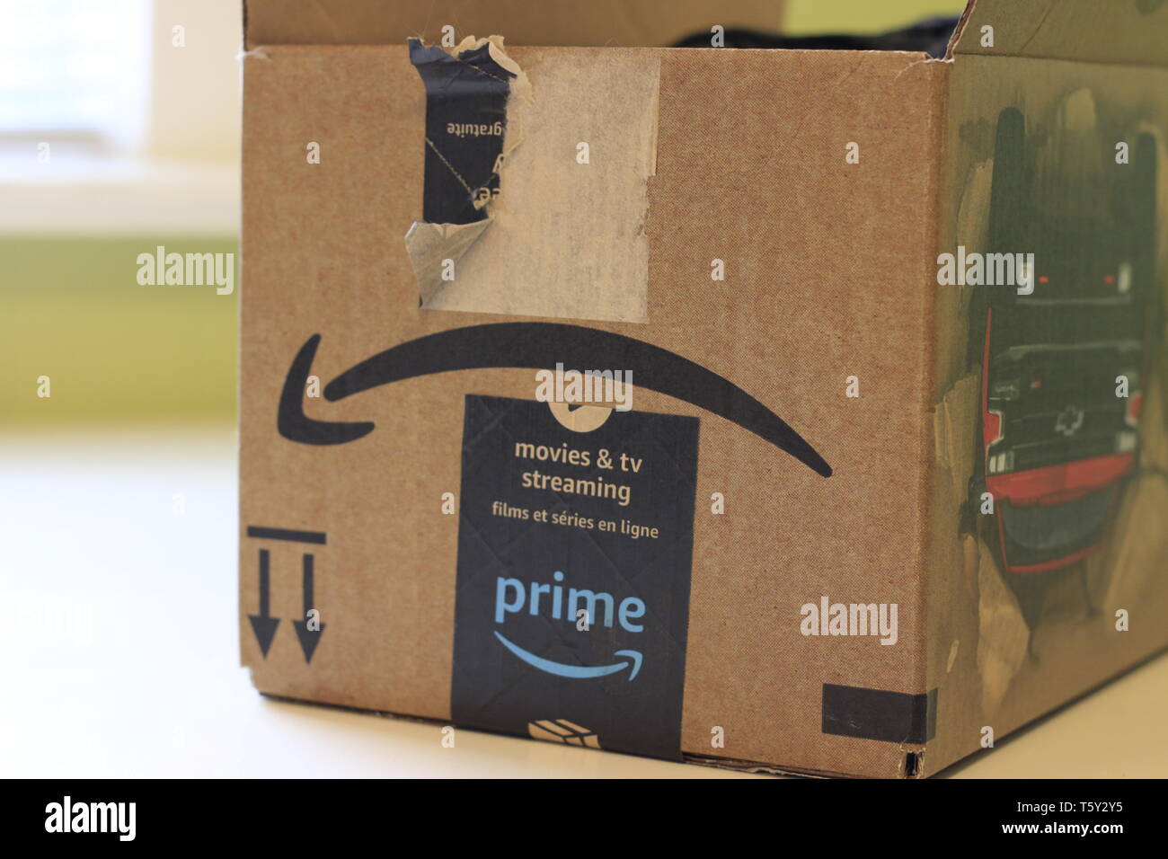 London Canada, April 27 2019: Editorial illustrative photograph of a  cardboard box with Amazon Prime tape on it. Concept of shopping online, or  using Stock Photo - Alamy