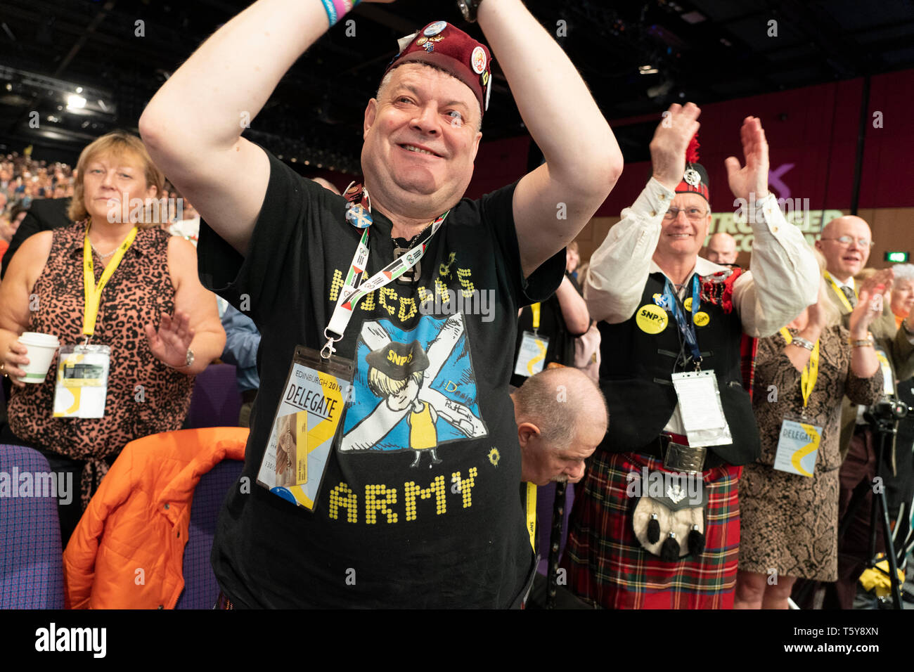Edinburgh, Scotland, UK. 27 April, 2019. SNP ( Scottish National Party) Spring Conference takes place at the EICC ( Edinburgh International Conference Centre) in Edinburgh. Pictured; Delegates in tartan enjoying proceedings of the conference on day one. Credit: Iain Masterton/Alamy Live News Stock Photo