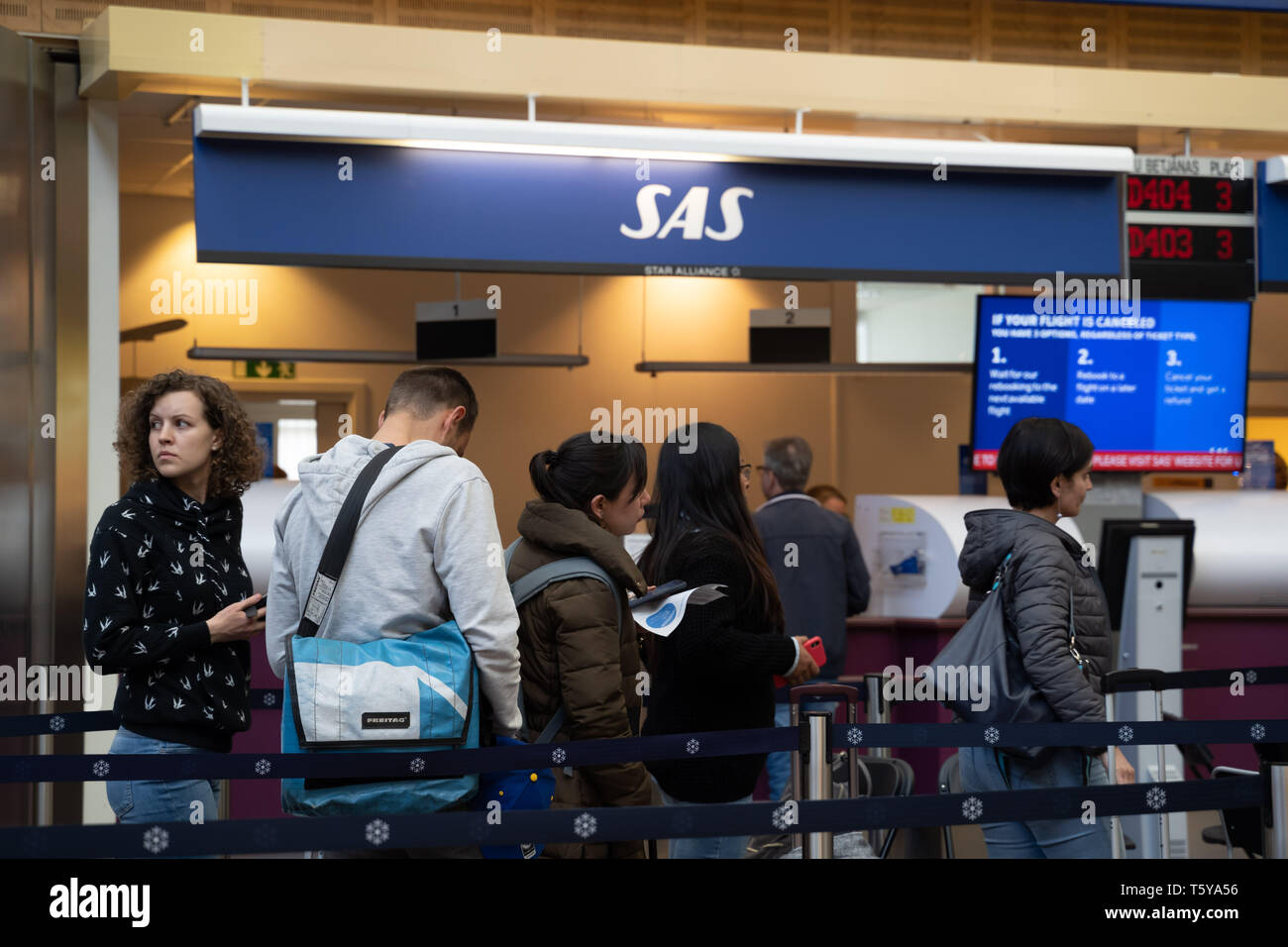 Stockholm, Sweden. 27th Apr, 2019. Stranded passengers wait at the service counter of Scandinavian Airlines (SAS) at Arlanda Airport, Stockholm, Sweden, April 27, 2019. A total of 1,409 Scandinavian Airlines (SAS) pilots from Sweden, Norway and Denmark went on strike on Friday morning, causing 673 departures being canceled so far and over 70,000 passengers affected, Swedish News SVT reported. SAS warns that the continuing strike could affect a further 100,000 passengers over the weekend. Credit: Wei Xuechao/Xinhua/Alamy Live News Stock Photo