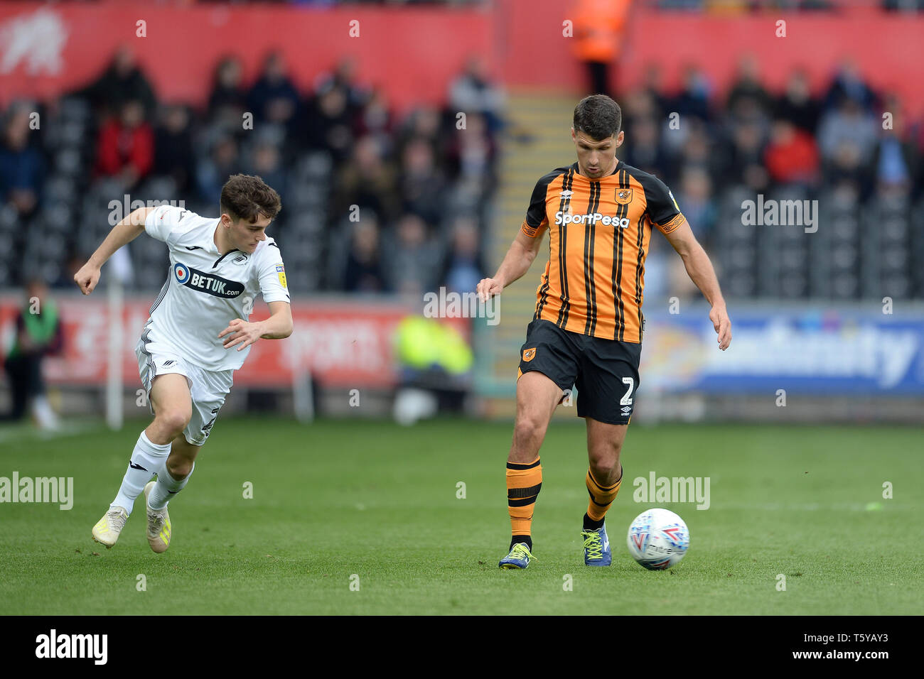 SWANSEA, WALES 27th April Daniel James of Swansea City about to challenge  Eric Lichaj of Hull City during the Sky Bet Championship match between  Swansea City and Hull City at the Liberty