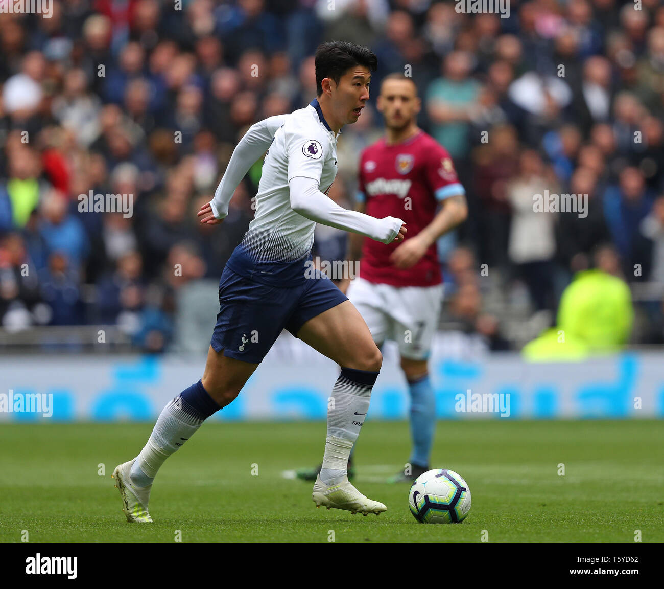 White Hart Lane Stadium, London England, UK, 27th April 2019. Son Heung-Min forward for Tottenham runs with the ball during the Barclays Premier League match between Tottenham Hotspur and West Ham Utd at White Hart Lane Stadium, London England on 27 April 2019. Stock Photo