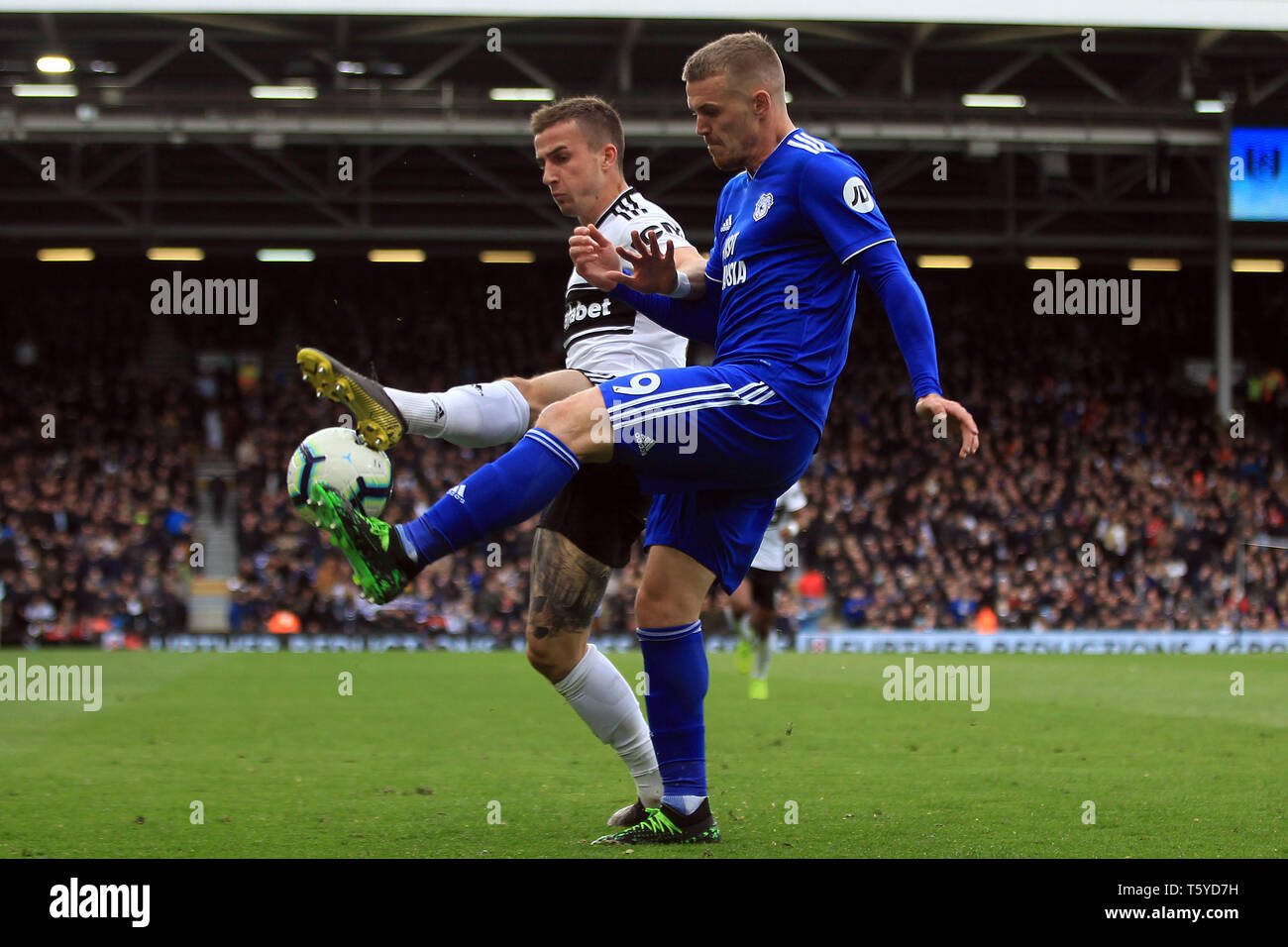 Craven Cottage, London, UK. 27th April 2019. Danny Ward of Cardiff City (R) is fouled by Calum Chambers of Fulham (L). Premier League match, Fulham v Cardiff City at Craven Cottage in London on Saturday 27th April 2019.  this image may only be used for Editorial purposes. Editorial use only, license required for commercial use. No use in betting, games or a single club/league/player publications. pic by Steffan Bowen/Andrew Orchard sports photography/Alamy Live news Credit: Andrew Orchard sports photography/Alamy Live News Stock Photo