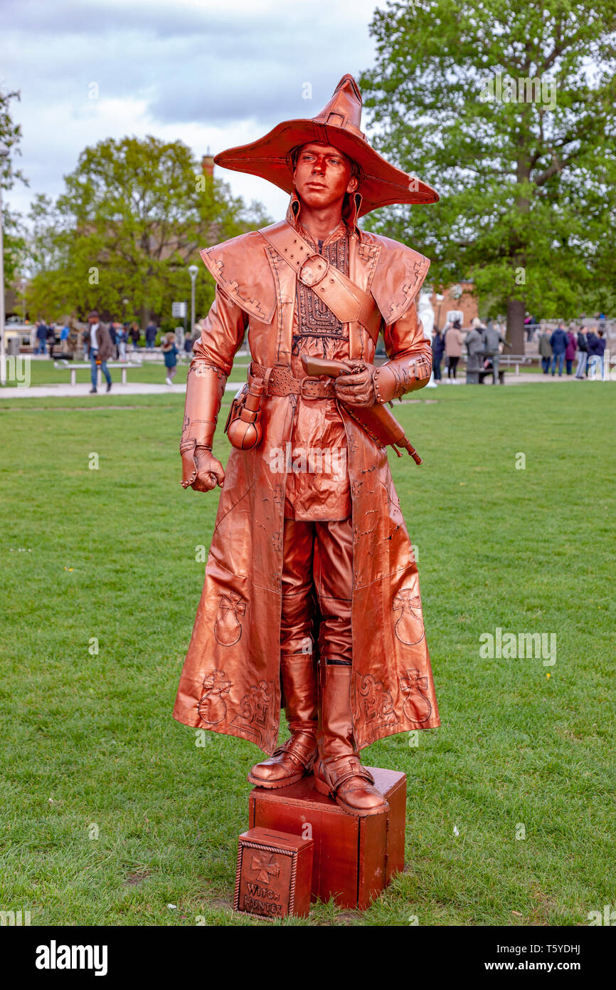 Stratford upon Avon, Warwickshire, 27th April 2019. The Witch Hunter, no10, Ukrainian. The first day of the U.K’s 2nd Living Statue Competition in Bancroft gardens which is held over the weekend, as part of the Shakespeare 455th Birthday Celebrations a unique event showcasing some of the best artists from around the world, including World and National Champions. Credit: Keith J Smith./Alamy Live News Stock Photo