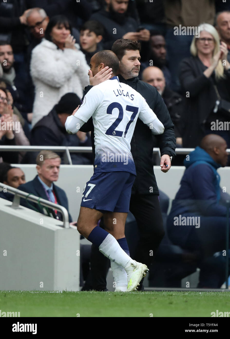 London, UK. 27th Apr 2019. Mauricio Pochettino (Spurs manager) puts his arm around Lucas Moura (TH) as he takes him off at the Tottenham Hotspur v West Ham United English Premier League match, at The Tottenham Hotspur Stadium, London, UK on April 27, 2019. **Editorial use only, license required for commercial use. No use in betting, games or a single club/league/player publications** Credit: Paul Marriott/Alamy Live News Stock Photo