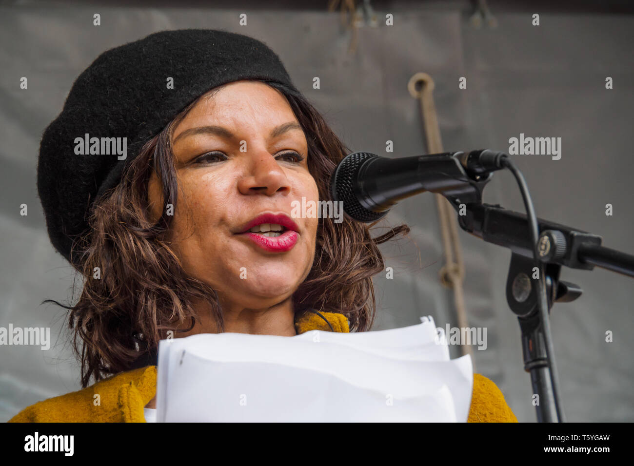 London, UK. 27th April 2019. Dorothea Jones  from The (Southall) Monitoring Group speaks at the rally after the march in Southall remembering the murders there of Gurdip Singh Chaggar and Blair Peach, calling for unity against racism. Chaggar, an 18 year old student, was murdered by racists in June 1976 and Peach was killed by a police officer when police rioted against protesters and the local community opposing a National Front rally on April 23rd 1979, 40 years ago. Credit: Peter Marshall/Alamy Live News Stock Photo
