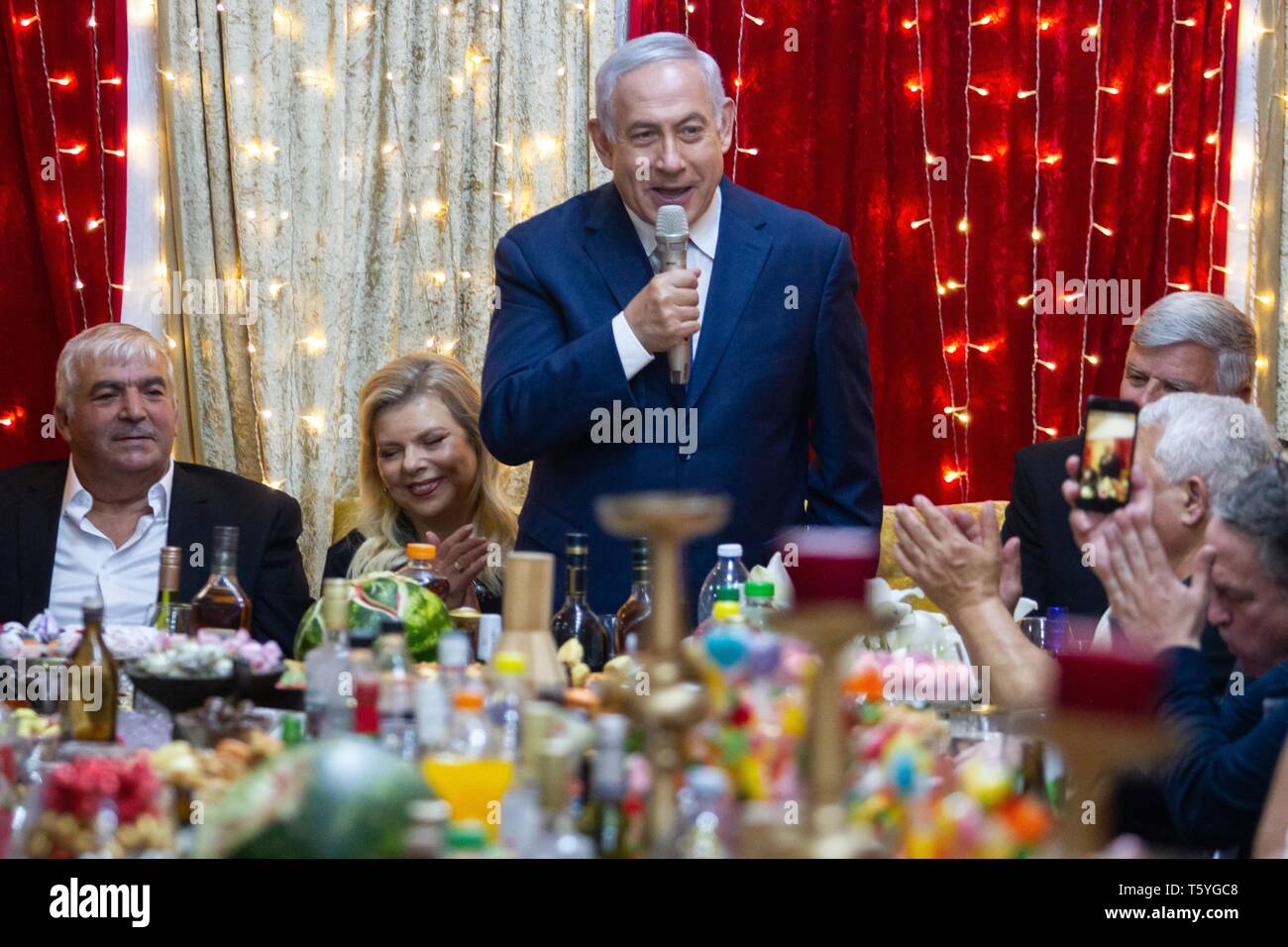 Or Akiva, Israel. 27th Apr, 2019. Israeli Prime Minister Benjamin Netanyahu (C) attends the Jewish Moroccan celebration of Mimouna, in Or Akiva, Israel, on April 27, 2019. Credit: JINI/Xinhua/Alamy Live News Stock Photo