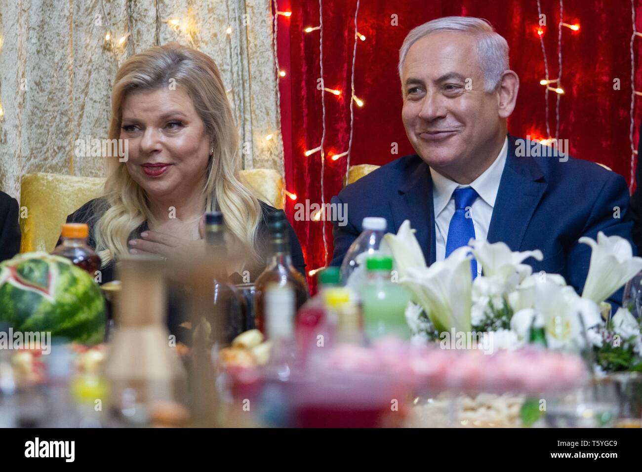 Or Akiva, Israel. 27th Apr, 2019. Israeli Prime Minister Benjamin Netanyahu (R) attends the Jewish Moroccan celebration of Mimouna, in Or Akiva, Israel, on April 27, 2019. Credit: JINI/Xinhua/Alamy Live News Stock Photo
