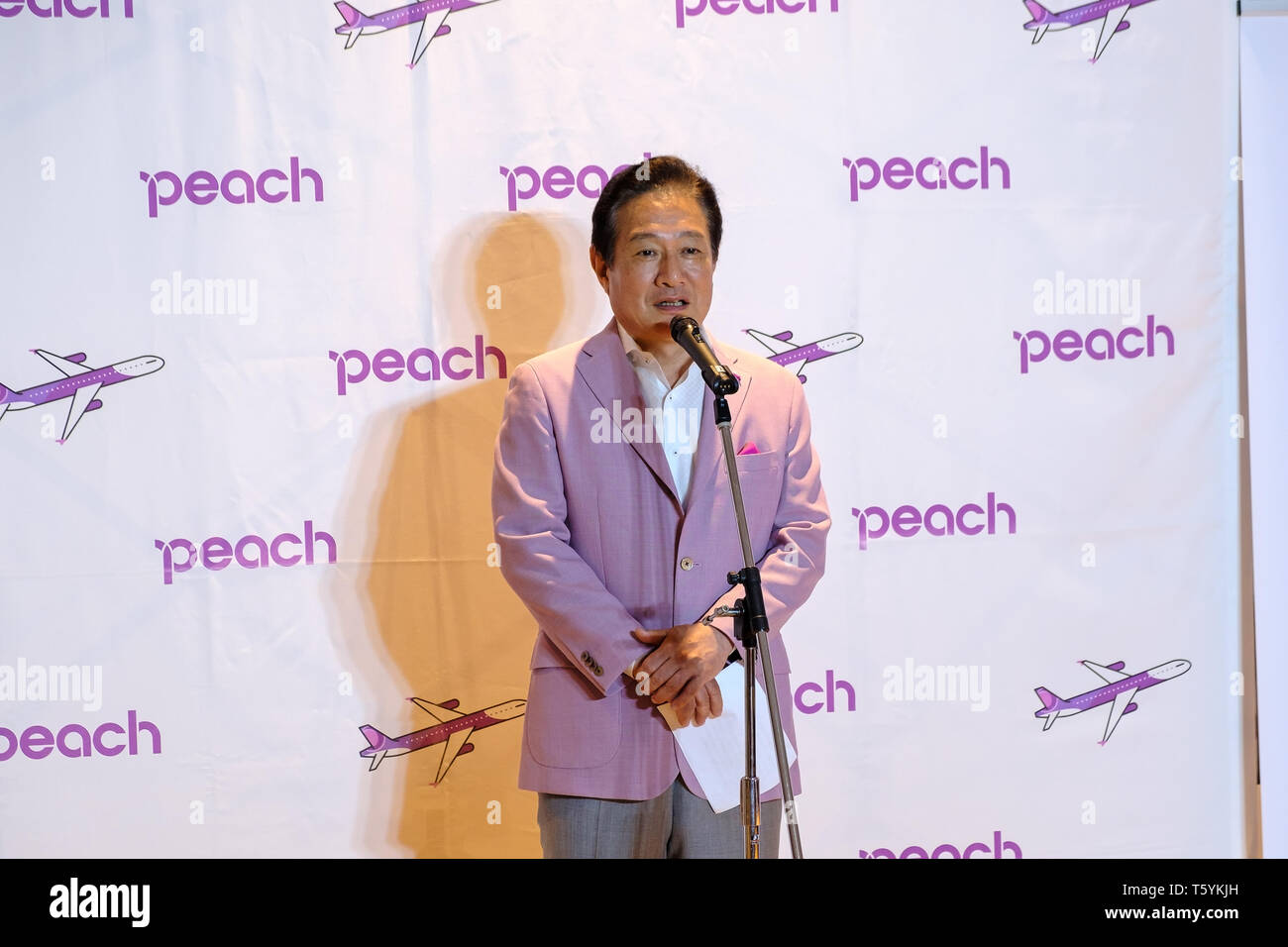 Mr. Shinichi Inoue, President and CEO of Peach seen speaking during the service ceremony. A service ceremony was held in front of the New Chitose Airport International Terminal No. 64 boarding gate. This is the second overseas flight from Sapporo by Peach following the Taoyuan International Airport (Taipei) service, which was launched in 2017. Stock Photo