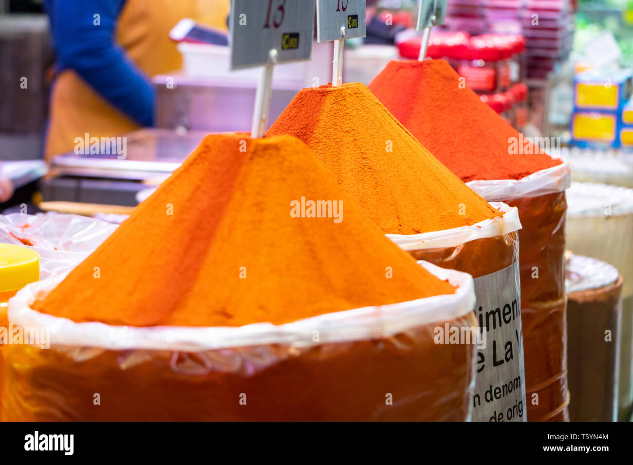 market stall in Valencia's Central Market selling chilli powder and curry spice in conical piles Stock Photo