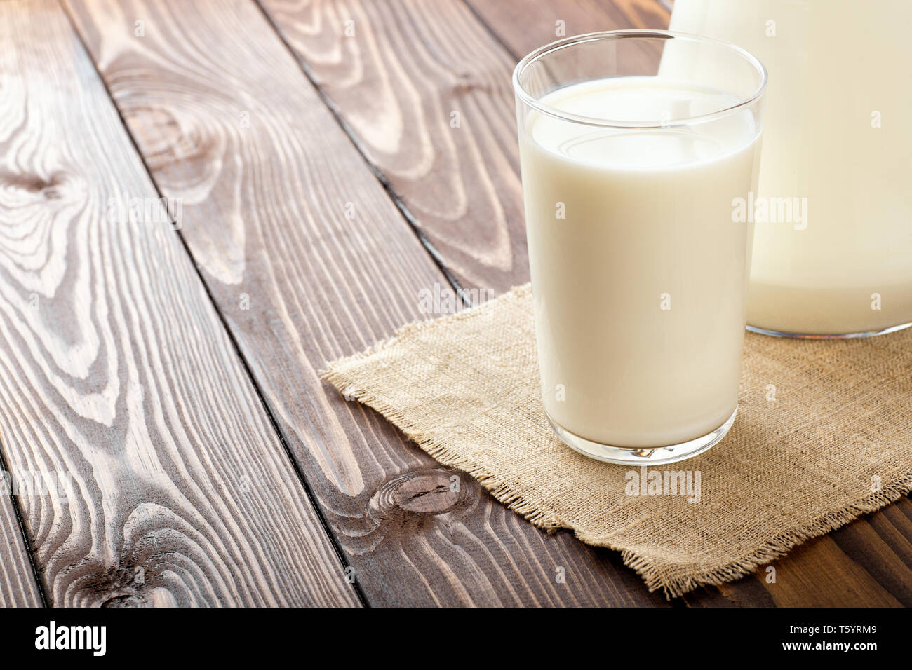 milk in glass on table Stock Photo