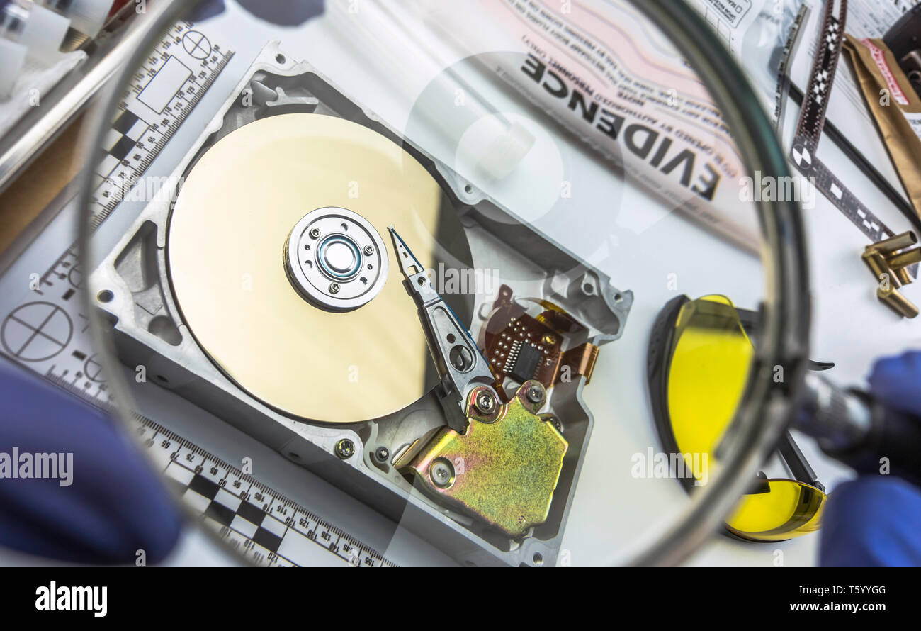 Police expert examines hard drive in search of evidence, conceptual image  Stock Photo - Alamy