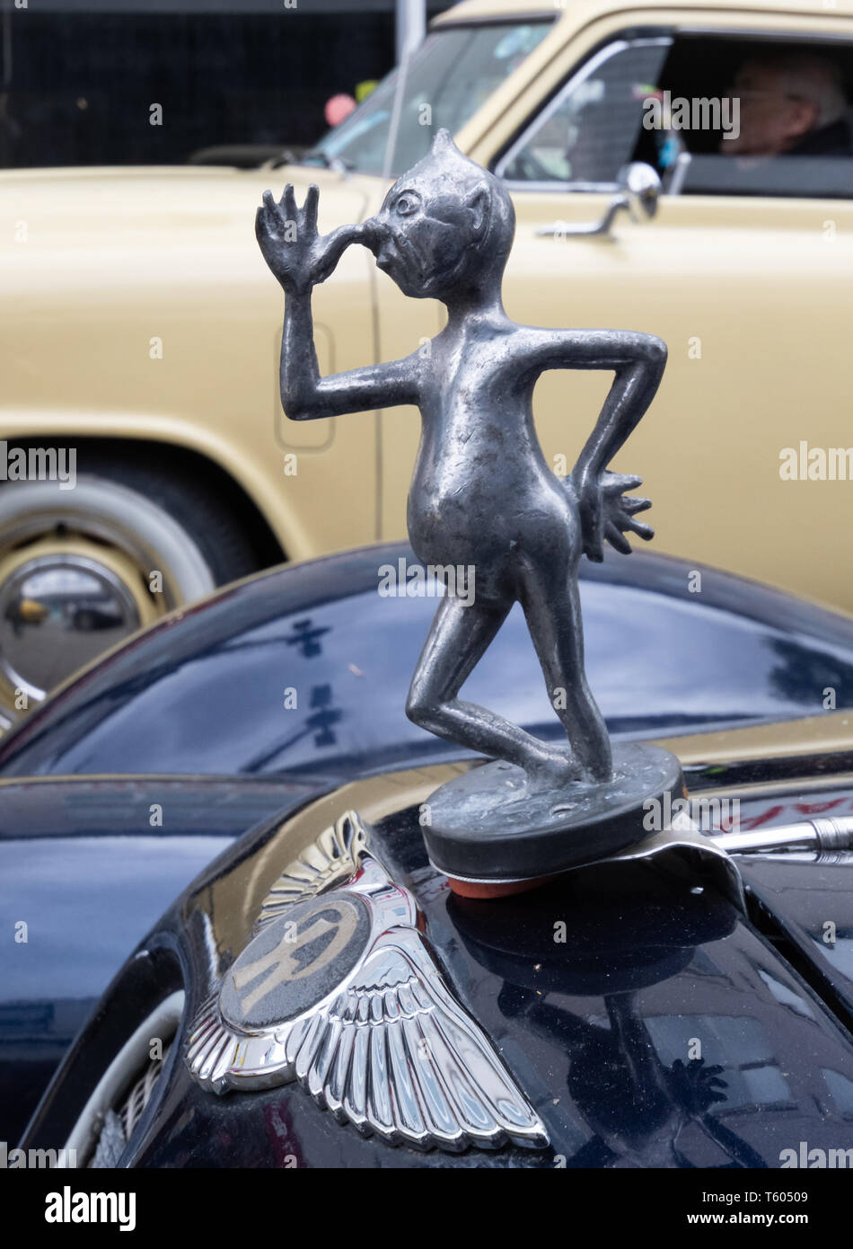 Amusing humorous rude automobile hood (car bonnet) ornament statue figurine Stock Photo