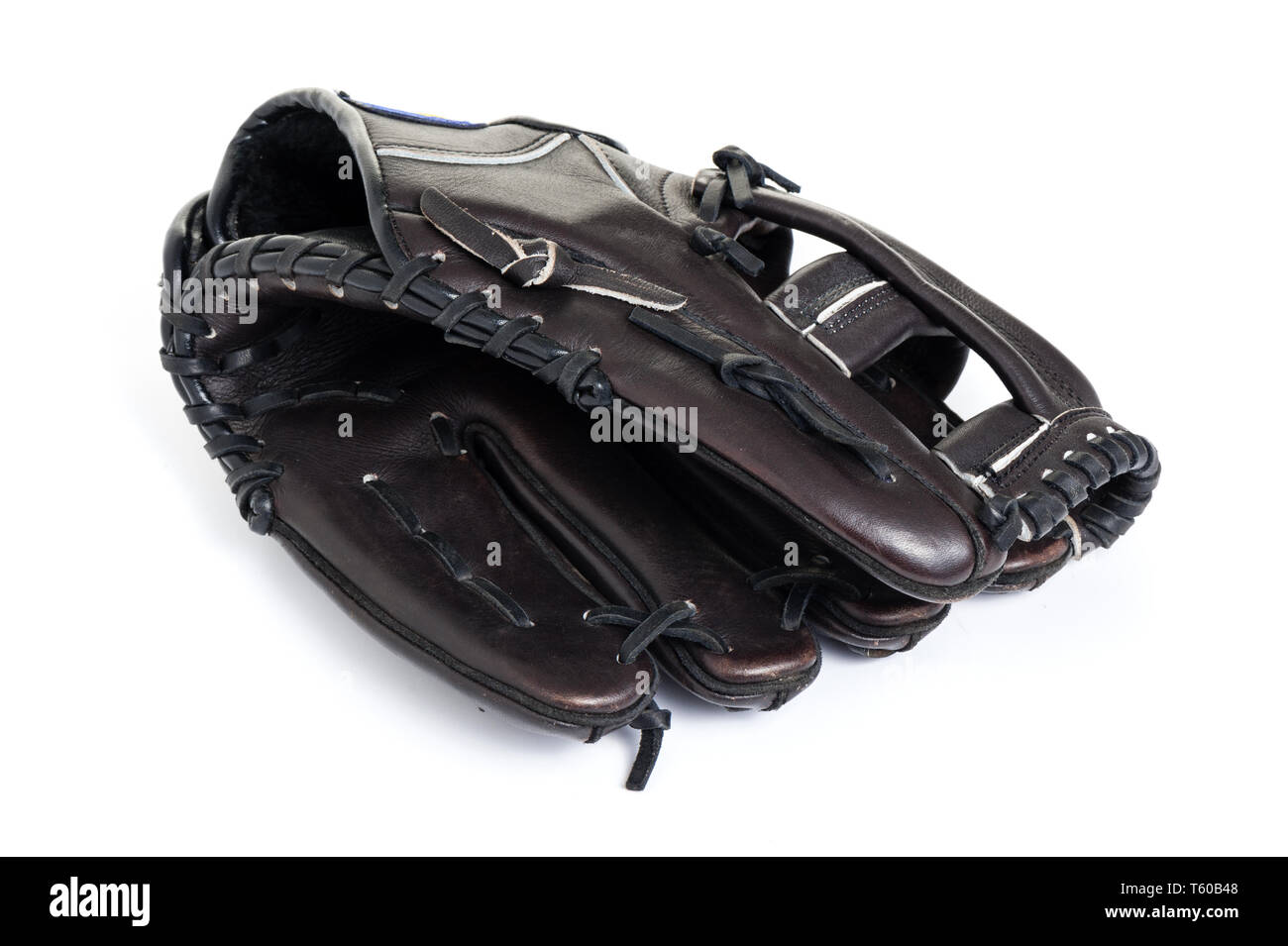 old chocolate brown baseball glove isolated over white background Stock