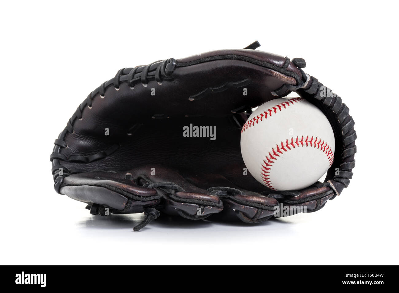 chocolate brown baseball glove with the ball isolated over white