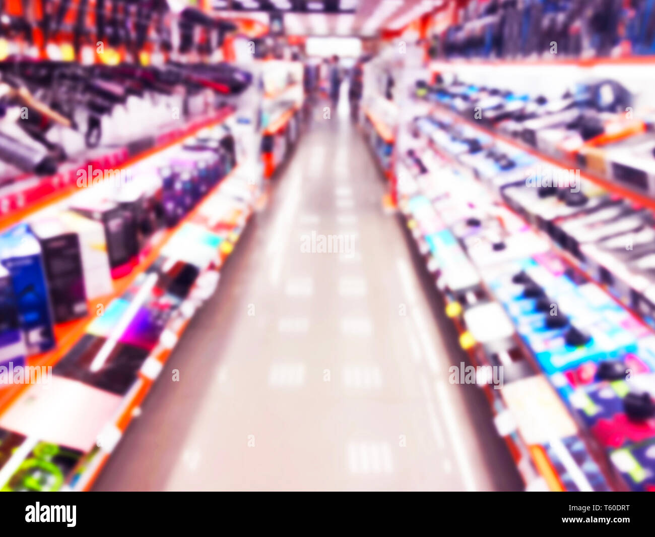 Abstract blur background with mobile store boutique in shopping mall. Eletronic department store interior with bokeh light blurred background. Defocus Stock Photo