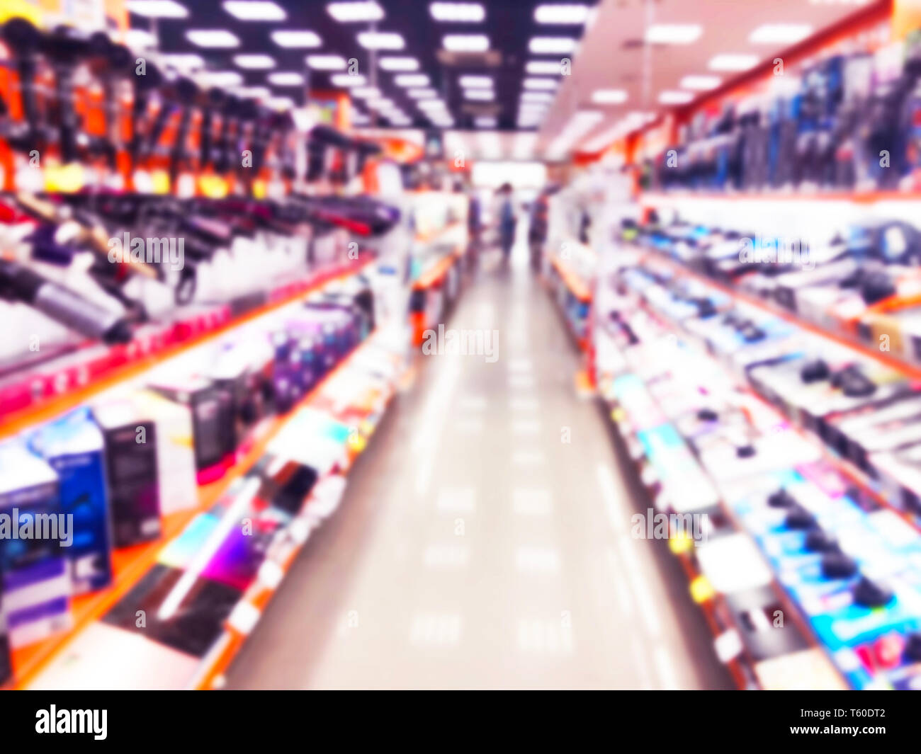 Abstract blur background with mobile store boutique in shopping mall. Eletronic department store interior with bokeh light blurred background. Defocus Stock Photo