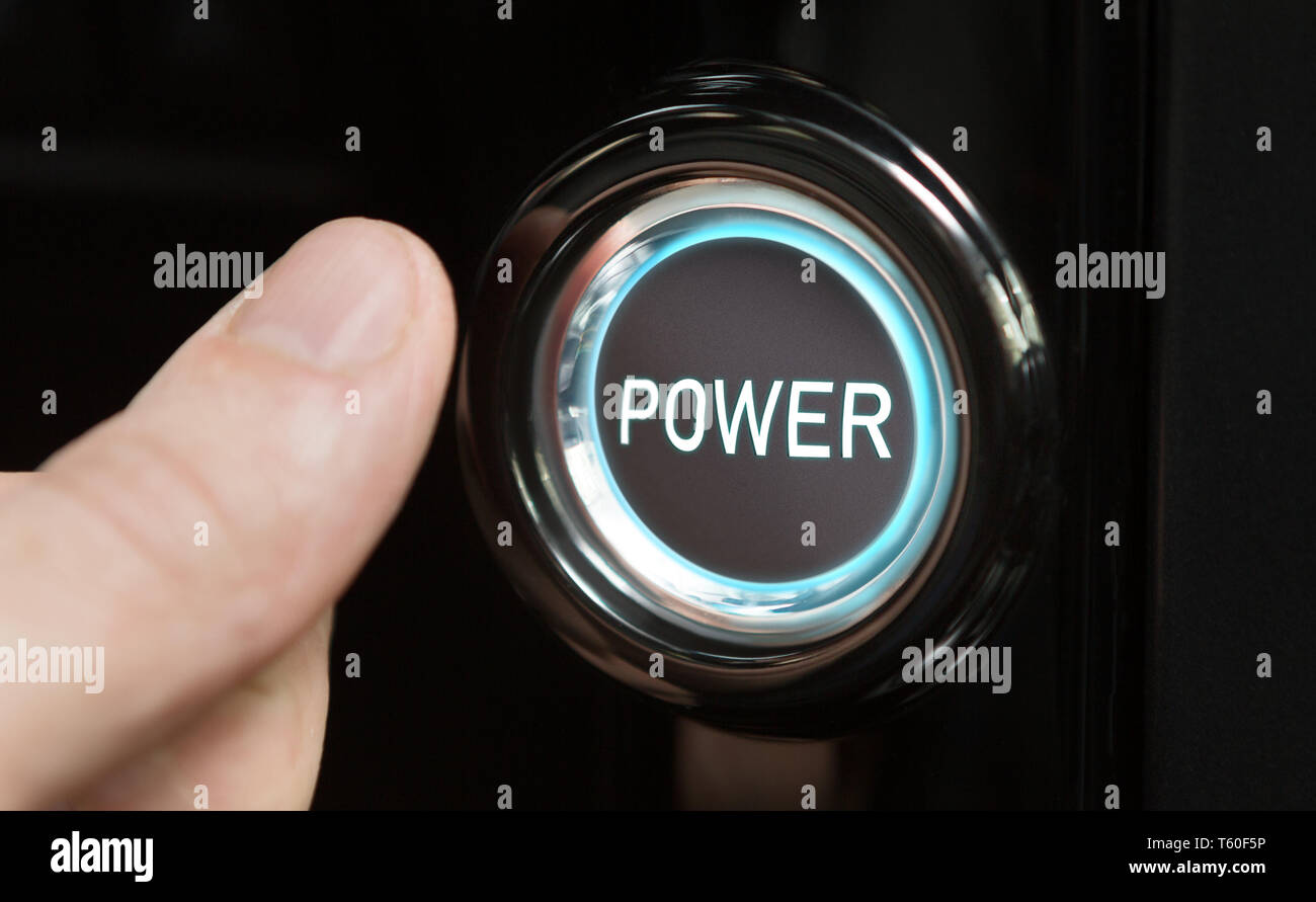 Male finger pushing button with text Power Stock Photo