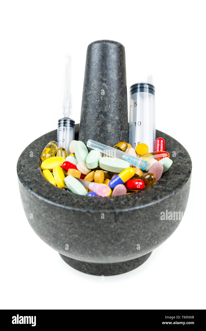 bowl-of-multicolored-pills-and-syringes-addiction-concept-stock-photo
