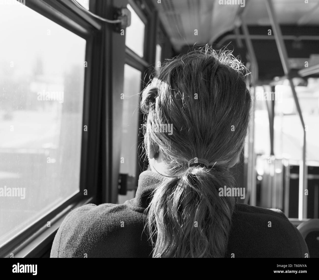 Rear view of a woman on a bus. Stock Photo