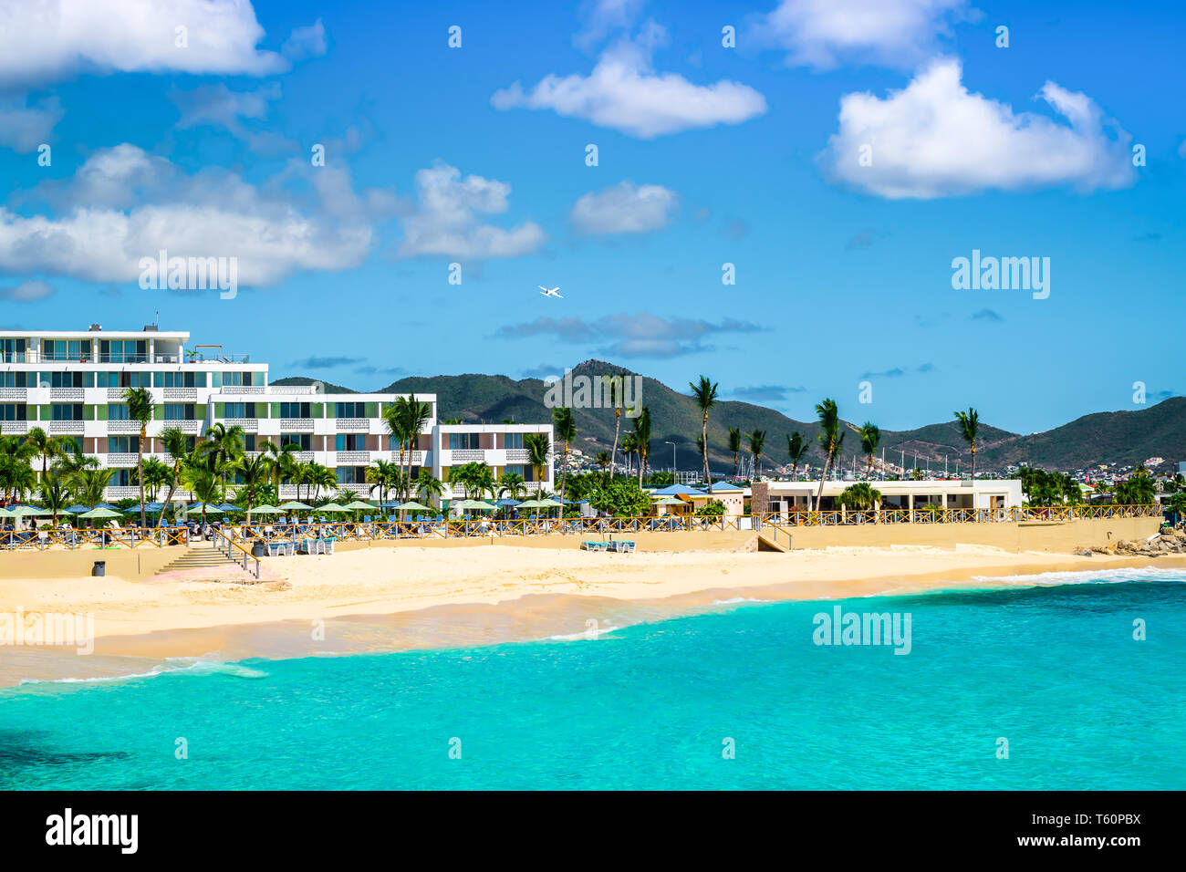 Most popular beach for tourists who come to watch aircraft landing at the airport behind the beautiful white sand beach of Maho Beach, Philipsburg, St Stock Photo
