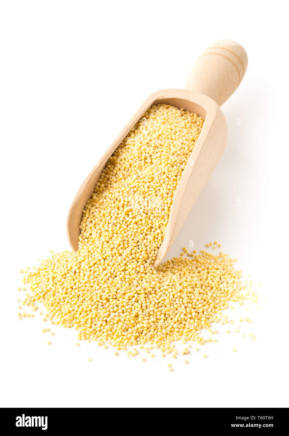 Pile of golden millet, a gluten free grain seed, in wooden scoop over white background Stock Photo