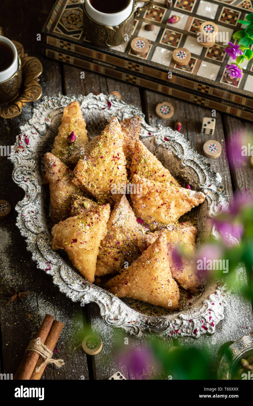 arabic sweet تمرية, tray of sweets with turkish coffee specially for ramadan Stock Photo