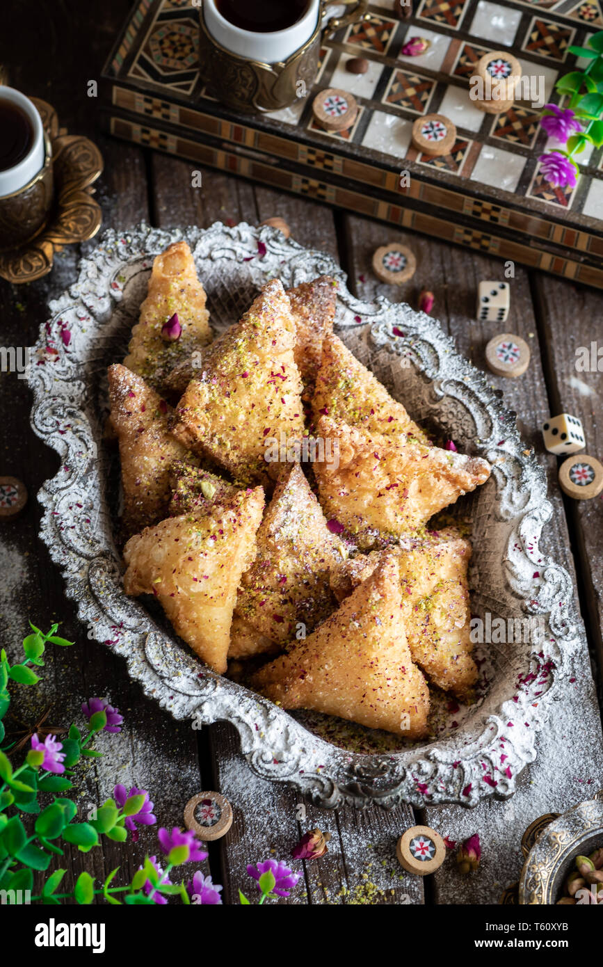 arabic sweet تمرية, tray of sweets with turkish coffee specially for ramadan Stock Photo