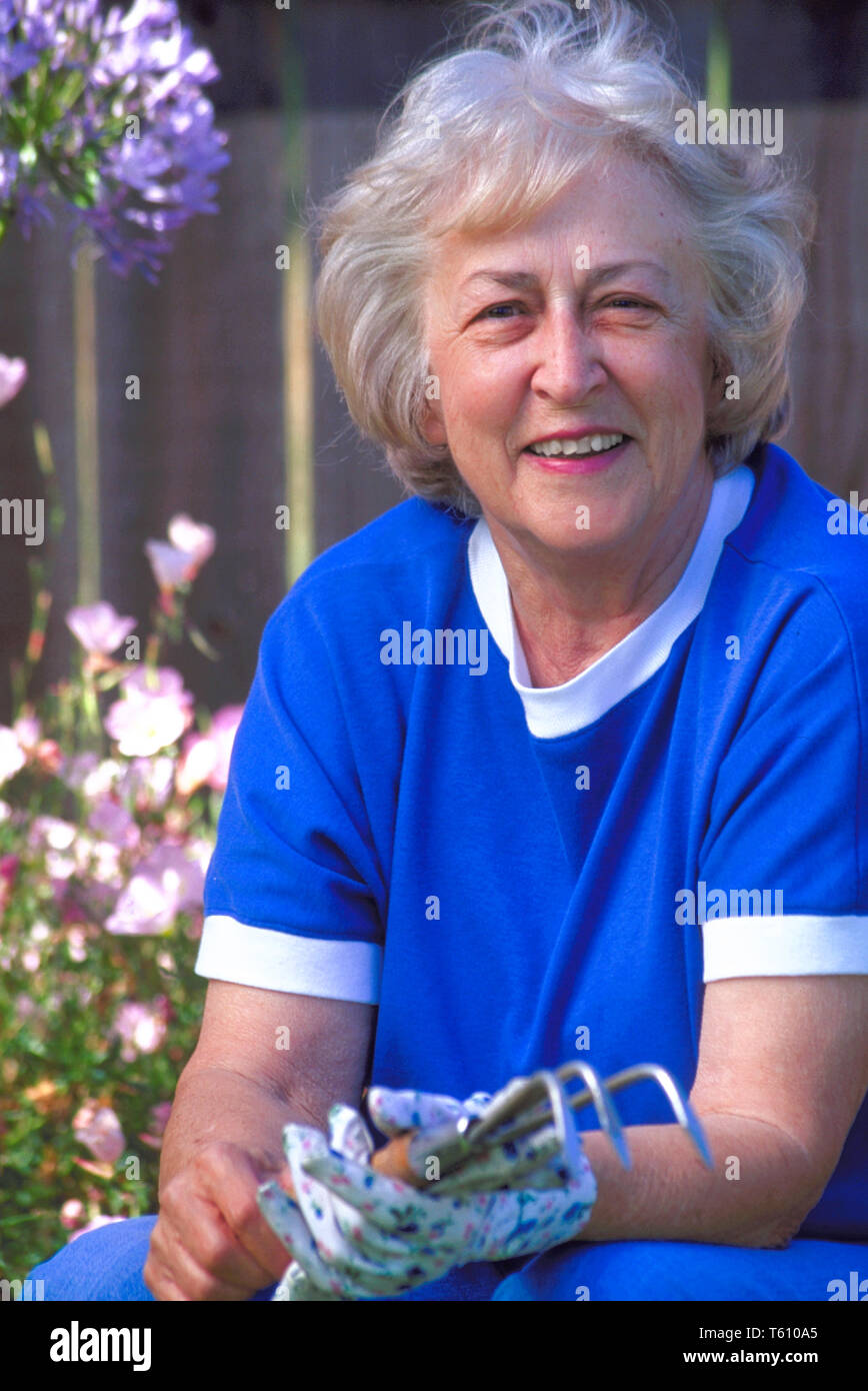 Elderly woman garden fence hi-res stock photography and images - Alamy