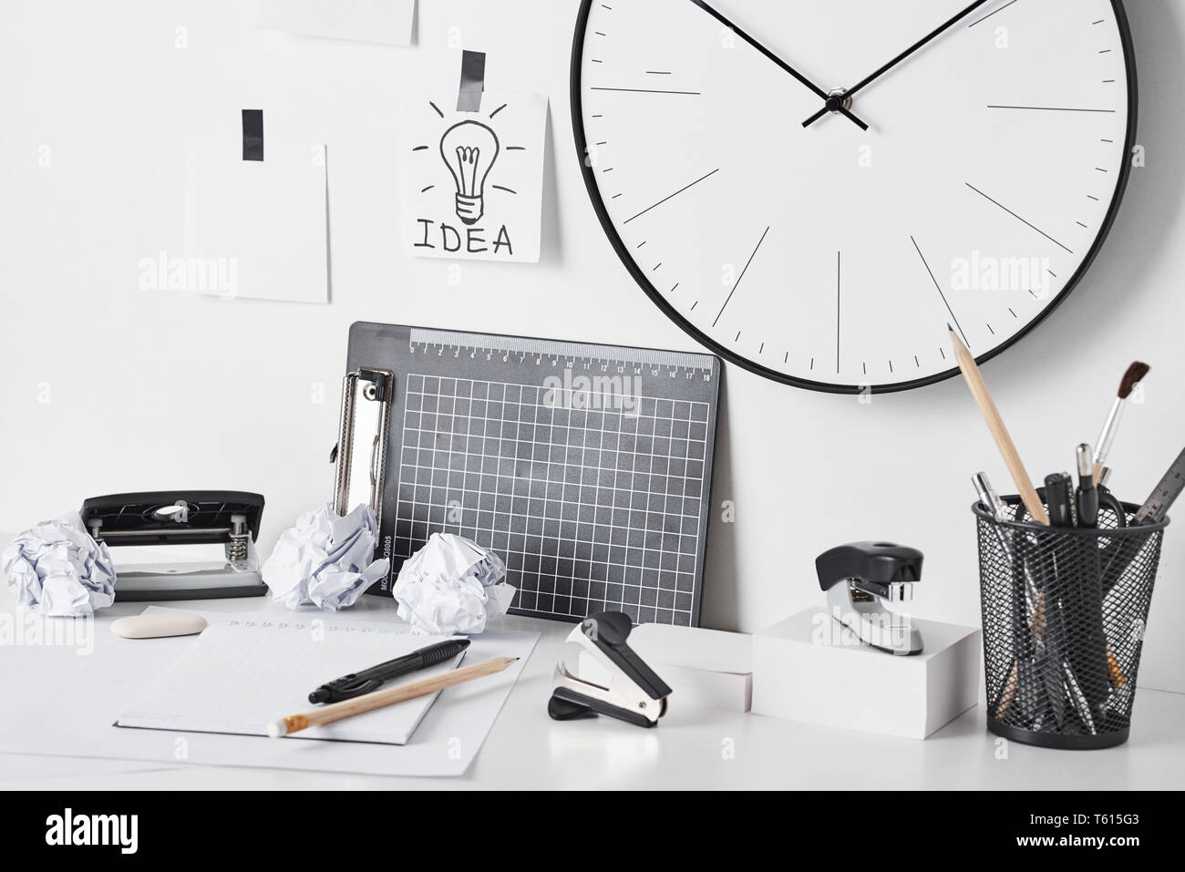 Office Supplies Sticky Notes And Wall Clock On White Background