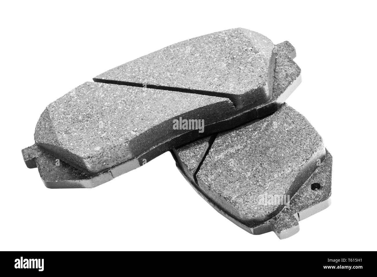 Brake pads isolated on white background. Auto parts. Brake pads isolated on white. Braking pads. Car part. Car detailing. Spare parts. Black and white Stock Photo