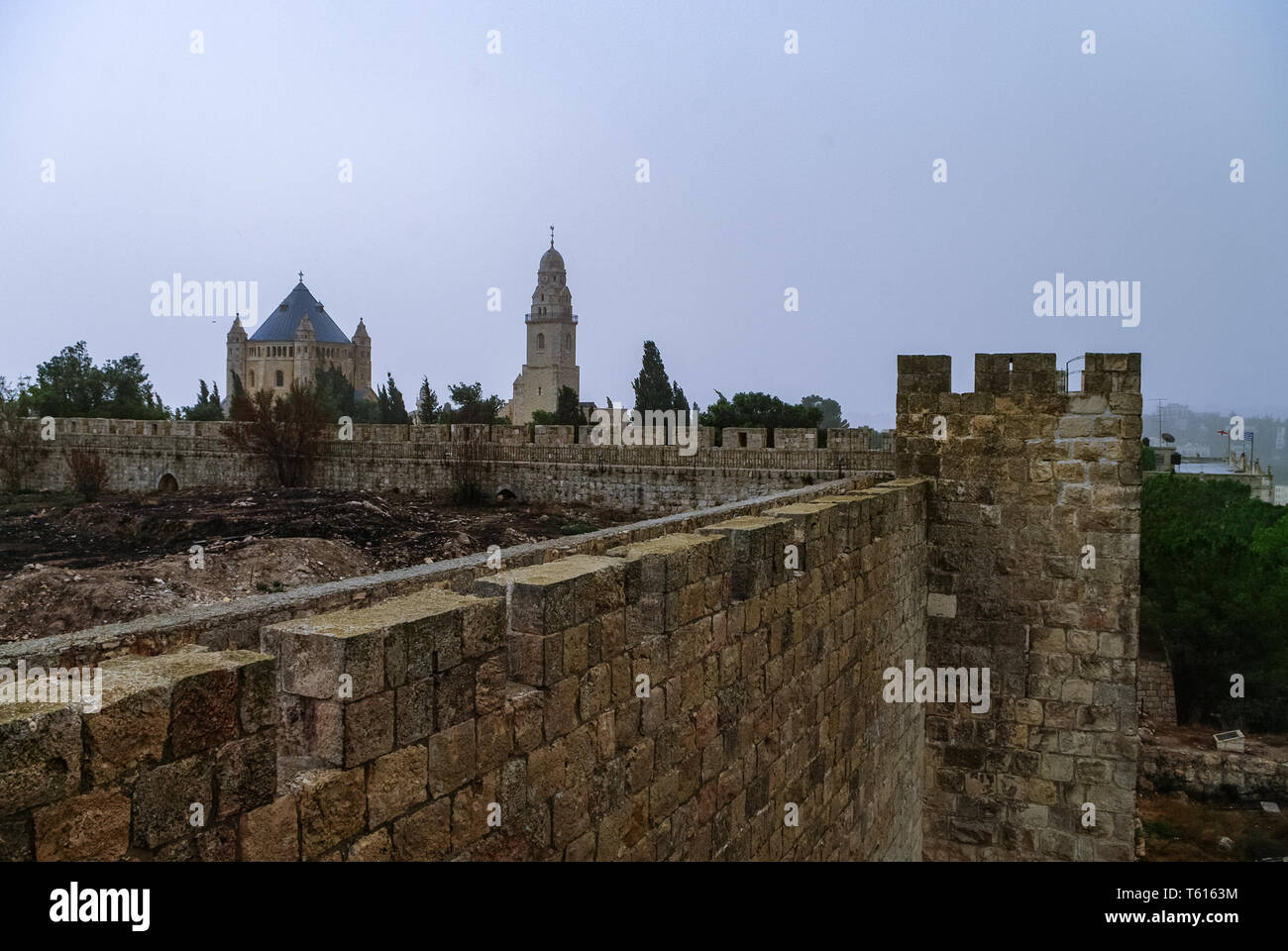 Old town wall and Franciscan monastery of dormition on mount Zion in Jerusalem, Israel Stock Photo