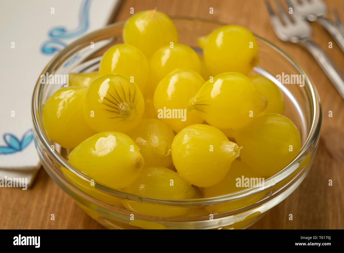 Glass bowl with traditional pickled Amsterdam silverskin onions close up Stock Photo