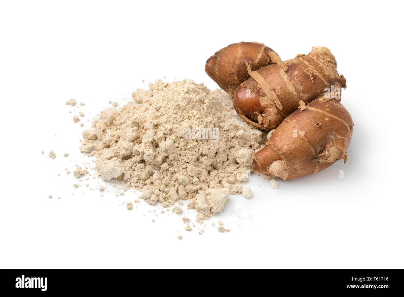 Fresh raw kencur rhizome and heap of dried powder isolated on white background Stock Photo